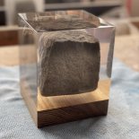 A paving stone suspended in the resin