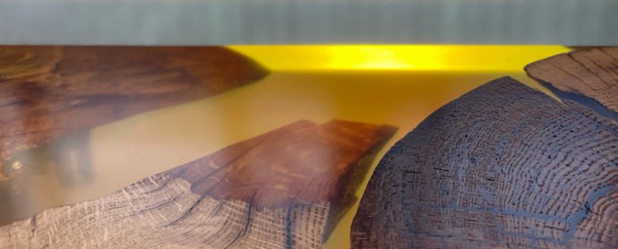Landscape of solid wood and amber-colored resin