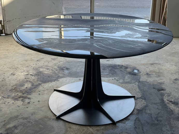 Round table in solid oxidized oak and steel base